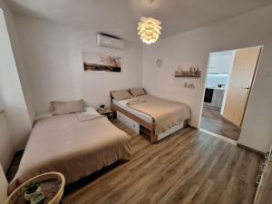 Postel nebo postele na pokoji v ubytování Apartma Pingo