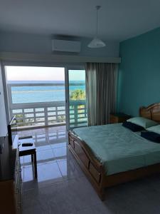 Ένα ή περισσότερα κρεβάτια σε δωμάτιο στο GARNET Beach Apartment