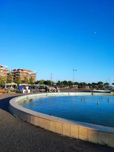 a large pool of water with people in it at SummerhouseVelipoje-Te Kompleksi Fishta-Q1,36 in Velipojë