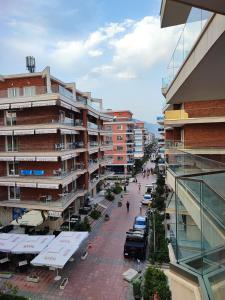 a view of a city street with tall buildings at SummerhouseVelipoje-Te Kompleksi Fishta-Q1,36 in Velipojë