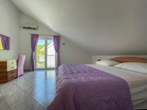 Łóżko lub łóżka w pokoju w obiekcie Apartments Marija Magdalena