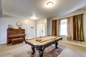 a room with a pool table and a piano at Spacious Vacation Rental Near Utah Lake! in Lehi