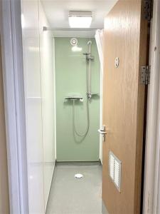 a bathroom with a shower with a glass door at ALTIDO Cosy rooms in Southampton in Southampton