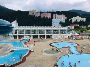 a view of a resort with two pools at Ryokan Yuzawa - Vacation STAY 14222v in Yuzawa