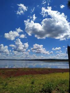 a large body of water with clouds in the sky at Blusky Lodge in Puerto Iguazú