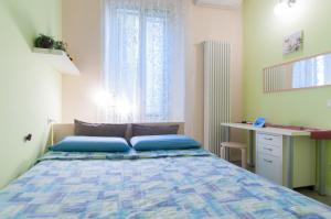Кровать или кровати в номере Il Cortiletto