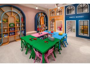 a classroom with tables and chairs in a library at Swandor Hotels & Resorts - Kemer in Kemer