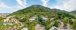 an aerial view of a town in front of a mountain at Club Wyndham Sea Pearl Phuket in Patong Beach