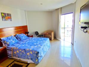 Letto o letti in una camera di De La Costa Hotel