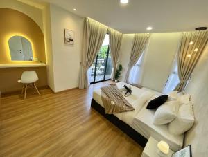 a bedroom with a large bed and a large window at The Cove Duplex 13pax 3Br 4bathroom 2parking by IWH Suites in Ipoh +36 photos