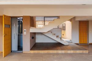 a staircase in the middle of a house at Departamento en Villa Carlos Paz in Villa Carlos Paz