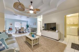 a living room with a couch and a table at Welcoming Edinburg Apartment - Pet Friendly! in Edinburg