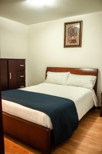 Postel nebo postele na pokoji v ubytování Nogal Suite Hotel Pasto