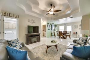 a living room with a couch and a table at Pet-Friendly Edinburg Apartment with Pool Access! in Edinburg