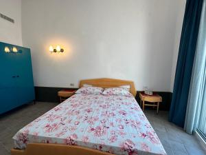 Een bed of bedden in een kamer bij AccalmiA