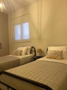 Ένα ή περισσότερα κρεβάτια σε δωμάτιο στο Thalassa Grammeno seaview house
