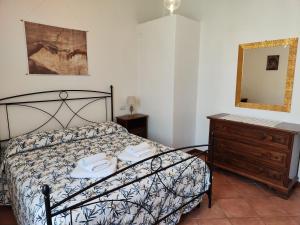 A bed or beds in a room at Casa di Pietro Aretino, Arezzo Centro Storico 4-8 letti
