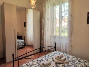 A bed or beds in a room at Casa di Pietro Aretino, Arezzo Centro Storico 4-8 letti