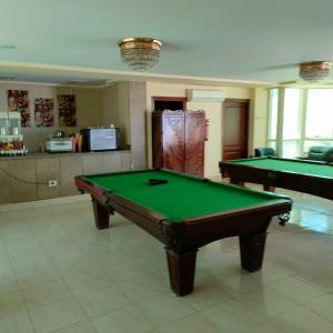 a room with two pool tables in a room at نادى البحارة الدولى بالسويس in Suez