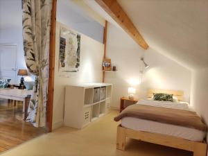 Postel nebo postele na pokoji v ubytování VILLAS-DU-LAC Appartements de vacances et Espace Spa privé