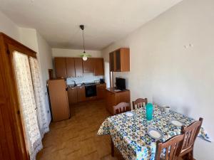 a kitchen with a table and a dining room at Anima Irpina in Gesualdo