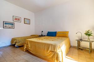 Postel nebo postele na pokoji v ubytování Casa nel Borgo Iris