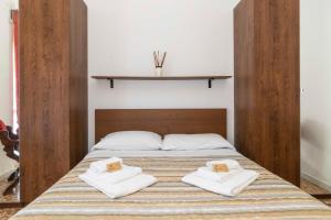 Katil atau katil-katil dalam bilik di Torino Pitagora Functional Flat