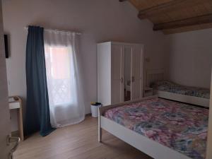 Postel nebo postele na pokoji v ubytování B&B La Casa Gialla