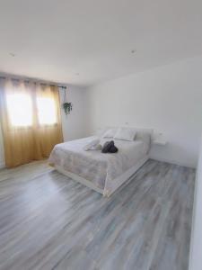 Una cama o camas en una habitación de Agarimo Home