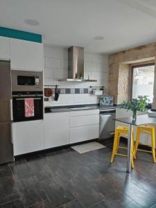 Kjøkken eller kjøkkenkrok på Agarimo Home