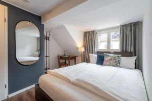 Postel nebo postele na pokoji v ubytování Hotel am Fischmarkt