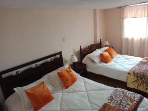 En eller flere senge i et værelse på Casa Rural Zaba Lago de Tota