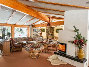 a living room with couches and a fireplace at Penzion Limba in Belá +48 photos