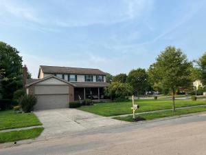 a house with a yard with a driveway at Eat Here, Stay Here, Love It Here! in Pickerington