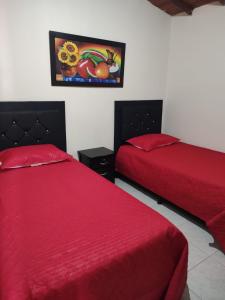 Giường trong phòng chung tại HOGAR DEL VIAJERO