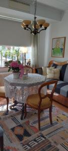 a living room with a table and a couch at Pilane B&B in Långekärr