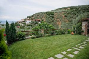 a garden with a hill in the background at Luxury Mansion in Pelion Hills in Afissos