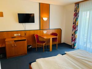TV/trung tâm giải trí tại Trip Inn Aktivhotel Sonnenhof bei Passau +20 ảnh