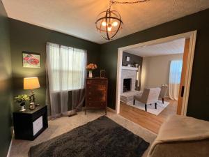a bedroom with a bed and a living room at Eat Here, Stay Here, Love It Here! in Pickerington