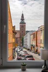 a view of a city street from a window at Apartament Alpaka 2 in Lidzbark Warmiński