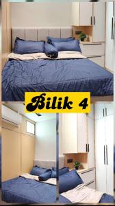 1 dormitorio con 1 cama con manta azul y cartel amarillo en Homestay KS Kota Bharu, en Kota Bharu