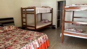 a room with two bunk beds and a bed at Villa Marlen Palomino in Palomino