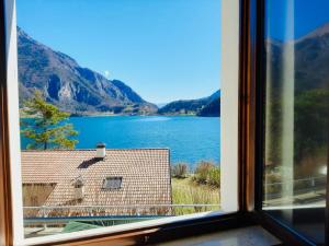 a view of a lake from a window at Casa Maria in Ledro