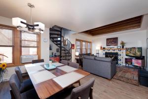 a dining room and living room with a table and chairs at 2 2 Ferringway 17 in Durango