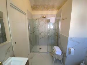 a bathroom with a shower and a sink at Casa Raiola by CapriRooms in Capri
