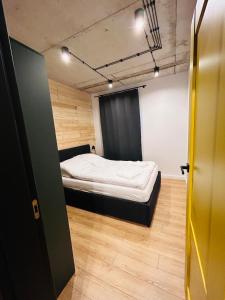 Postelja oz. postelje v sobi nastanitve Apartament LOFTykocin + 20 fotografij