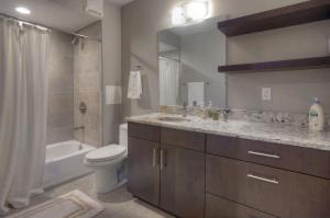 a bathroom with a toilet and a sink and a shower at 572 E 3rd Avenue in Durango +20 photos