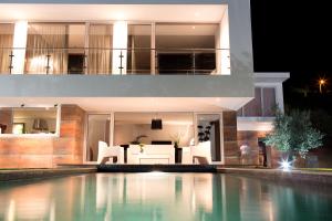 a house with a swimming pool at night at Quinta Do Bosque in Mesão Frio