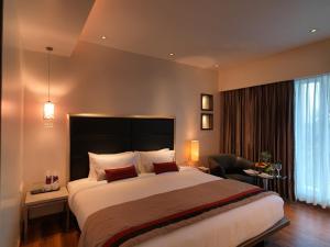 Spree Shivai Hotel Pune客房内的一张或多张床位