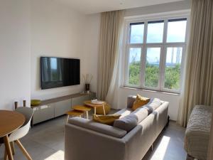 Telewizja i/lub zestaw kina domowego w obiekcie Lifestyle Apartments